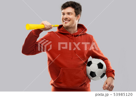 man or football fan with soccer ball and vuvuzela 53985120