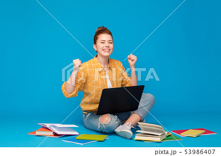 happy student girl with laptop celebrating success happy student girl with laptop celebrating success 53986407