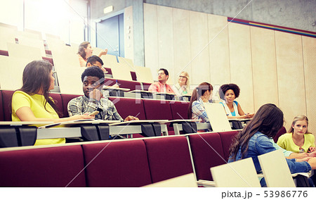 group of students with notebooks at lecture hall group of students with notebooks at lecture hall 53986776