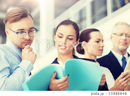 business team with folders meeting at office business team with folders meeting at office 53986848