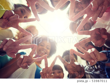 international students showing peace or v sign 53987011
