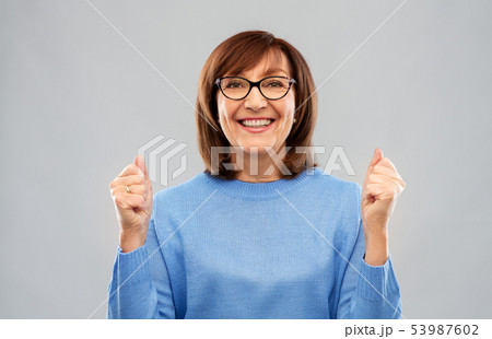 portrait of happy senior woman celebrating triumph portrait of happy senior woman celebrating triumph 53987602