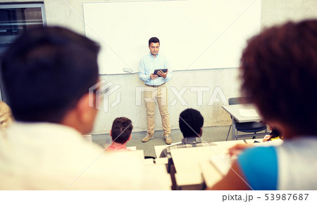 students and teacher with tablet pc at lecture students and teacher with tablet pc at lecture 53987687