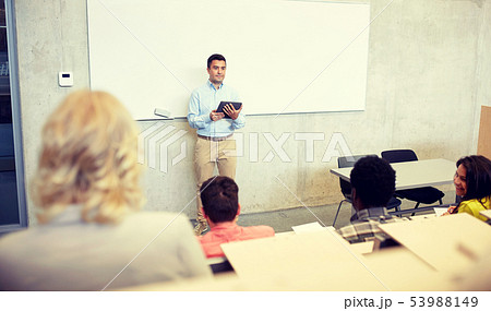 students and teacher with tablet pc at lecture students and teacher with tablet pc at lecture 53988149