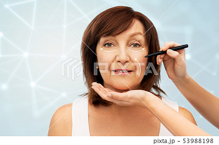 senior woman and hands with cosmetic marker senior woman and hands with cosmetic marker 53988198