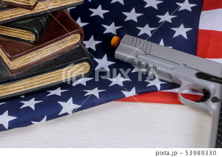 American firearm handgun lying on US flag 53989330