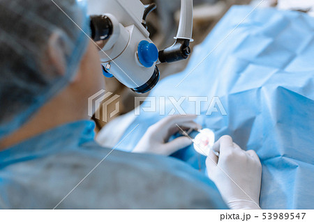 A professional ophthalmologist performs eye A professional ophthalmologist performs eye 53989547