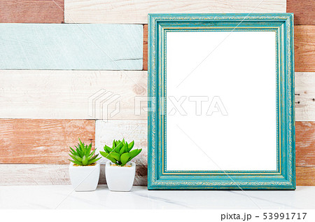 Blank vintage photo frame on wooden wall with Blank vintage photo frame on wooden wall with 53991717