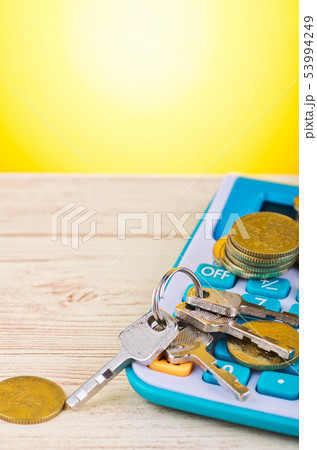 stacking coin with bunch of key on calculator stacking coin with bunch of key on calculator 53994249