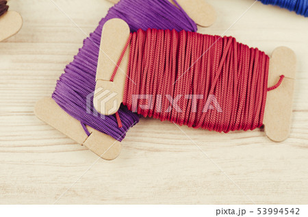 colorful stacking cotton yarn wool on wooden desk colorful stacking cotton yarn wool on wooden desk 53994542