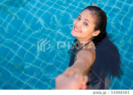 Young beautiful Asian tourist woman enjoying vacation 53998365