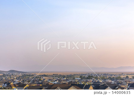 Hazy sky over homes in Eagle Mountain Utah Hazy sky over homes in Eagle Mountain Utah 54000635