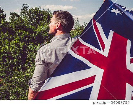 Attractive, young man waving a British Flag Attractive, young man waving a British Flag 54007734