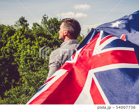 Handsome man waving the Flag of Australia Handsome man waving the Flag of Australia 54007736