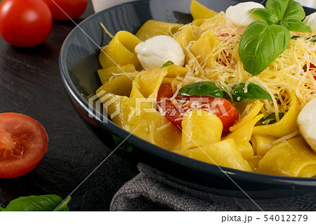 Yellow italian pasta pappardelle, fettuccine or 54012279
