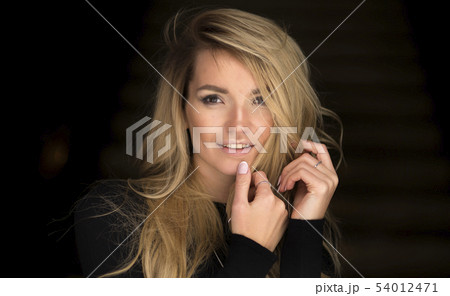 Indoor portrait of a young beautiful fashionable. Female fashion, beauty and advertisement concept. 54012471
