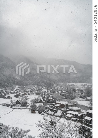 Snowfall at small town in valley mountain Snowfall at small town in valley mountain 54012956