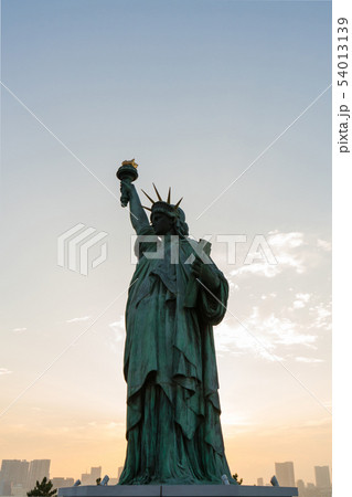 Statue of liberty at sunset Statue of liberty at sunset 54013139