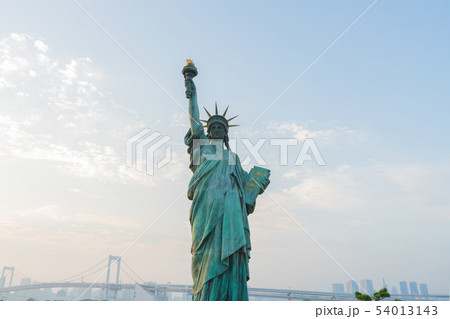 Liberty statue in city with blue sky Liberty statue in city with blue sky 54013143