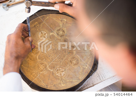 chaser of copper at work 54014464
