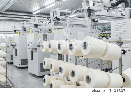production of threads in a textile factory 54018074