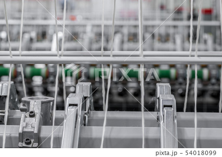 spools of thread at a textile factory 54018099