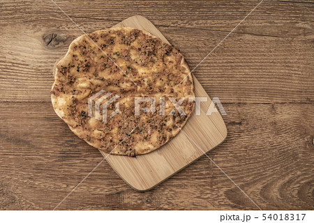 Lahmacun, Turkish Pizza on a wooden table Lahmacun, Turkish Pizza on a wooden table 54018317