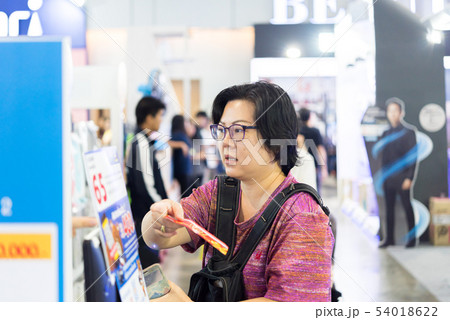 Asian woman with shopping cart in department store 54018622