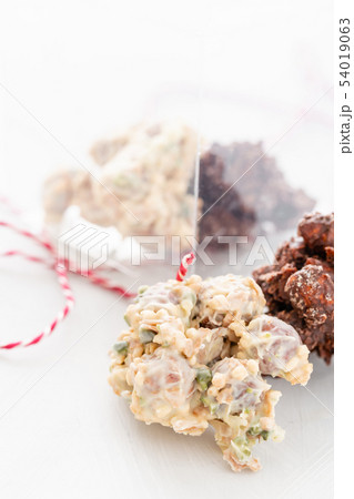 Rocks with chocolate and nuts. Christmas theme. Healthy sweet dessert snack. Granola bar with nuts 54019063
