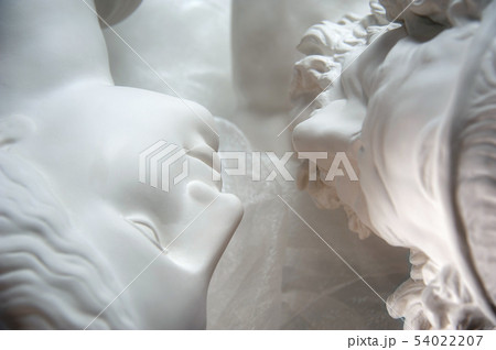 Antique statues of woman and man heads close up. Concept of style, vintage, love. Antique statues of woman and man heads close up. Concept of style, vintage, love. 54022207