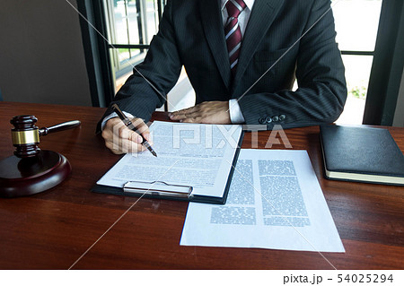 Lawyer working with contract papers on the table. Lawyer working with contract papers on the table. 54025294