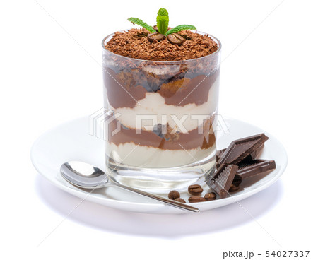Classic tiramisu dessert in a glass on plate with spoon isolated on a white with clipping path Classic tiramisu dessert in a glass on plate with spoon isolated on a white with clipping path 54027337