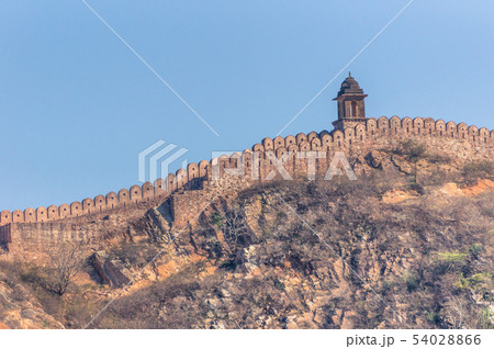 Ancient Amer wall on top of hills near Jaipur Ancient Amer wall on top of hills near Jaipur 54028866