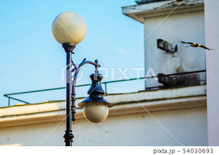 Old Black Street Lamp with White Round Plafonds Old Black Street Lamp with White Round Plafonds 54030693