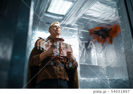 Space traveler looks out of the teleport, shuttle Space traveler looks out of the teleport, shuttle 54031897