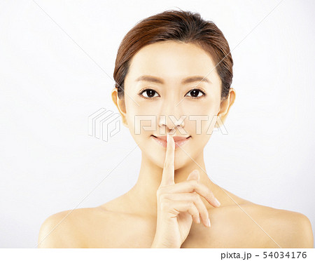Portrait of young beauty showing silence gesture Portrait of young beauty showing silence gesture 54034176