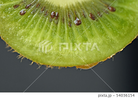 Slices of kiwi fruit on black background Slices of kiwi fruit on black background 54036154