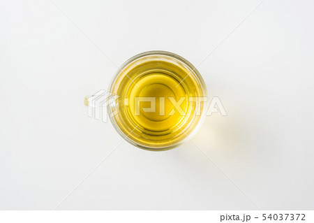 Top view of glass cup of hot tea on white 54037372