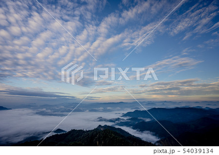 The sea of fog with forests and mountains valley The sea of fog with forests and mountains valley 54039134