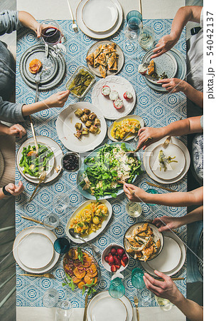Mediterranean style dinner and human hands 54042137
