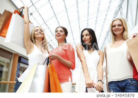 Happy girls in shopping mall 54045870