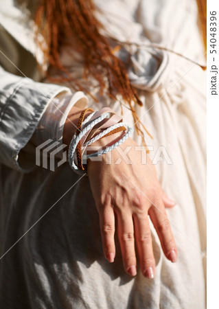 hand of fashionable girl dressed in white hand of fashionable girl dressed in white 54048396