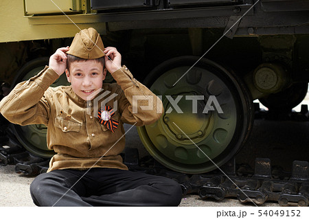 Boy dressed in Soviet military uniform during the Boy dressed in Soviet military uniform during the 54049152