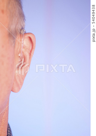 Man with hearing aid 54049438