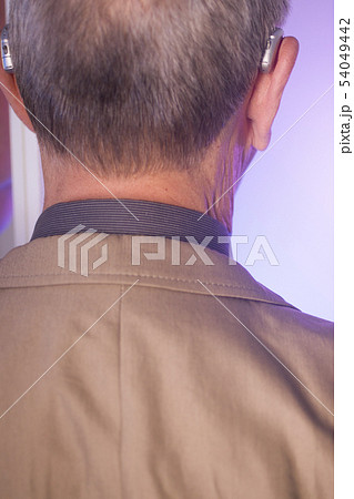 Man with hearing aid 54049442