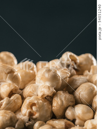 pile of caramel corn on black background pile of caramel corn on black background 54051240