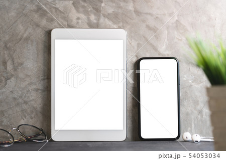 tablet and phone showing blank screen 54053034