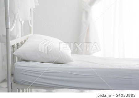 empty white bed and pillow in bedroom empty white bed and pillow in bedroom 54053985