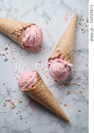 Delicious strawberry ice cream cone Delicious strawberry ice cream cone 54054671