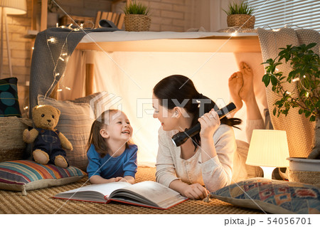 mother and daughter playing in tent 54056701